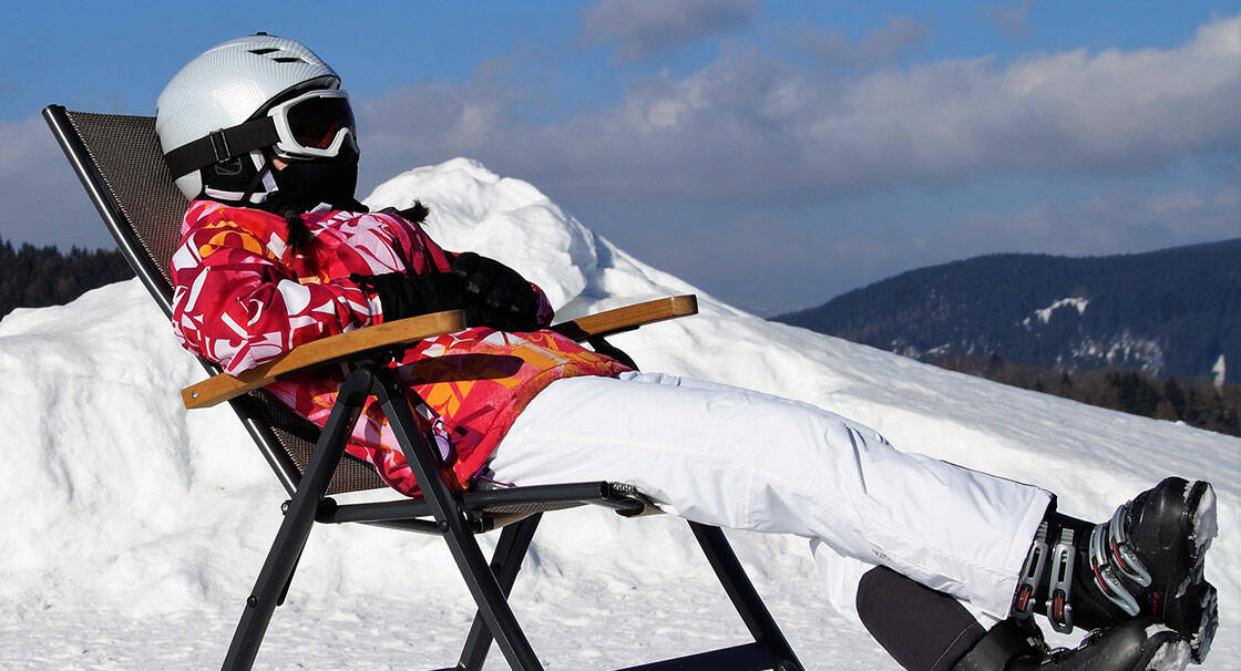 skier having a break and relaxing